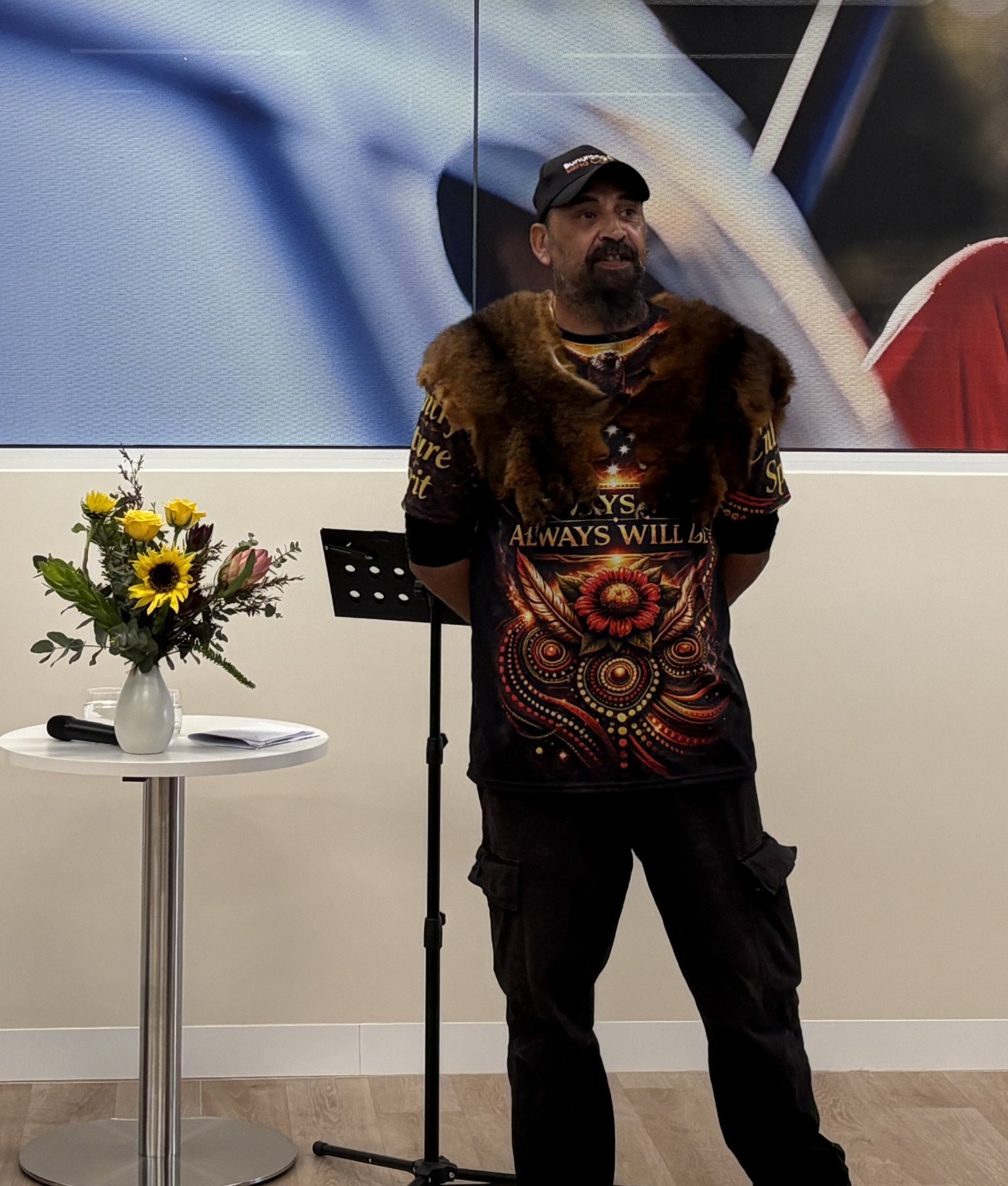 Uncle Mark Brown speaking at a cultural gathering